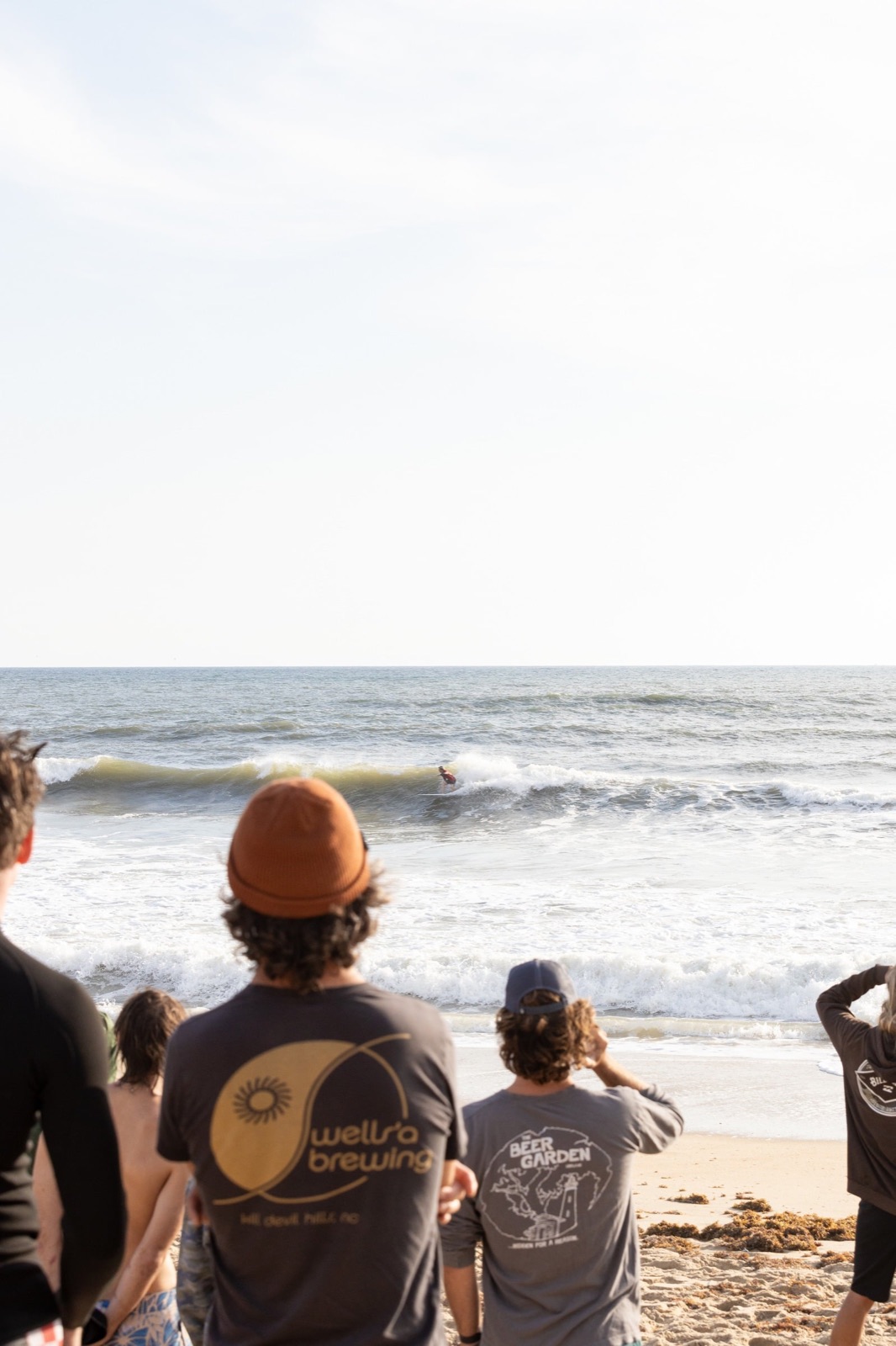 The crowd watches a competitor drop into a wave at Kitty Hawk
